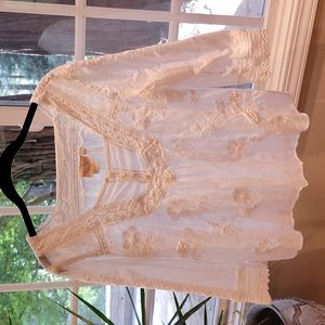 Sheer white blouse w embroidery.